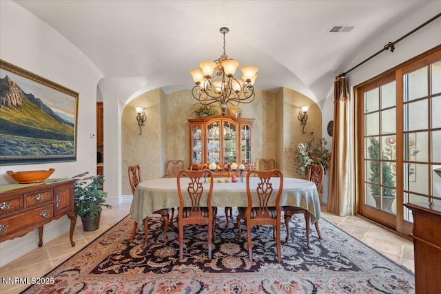 1555 Boulder Field Way, Reno, NV 89511 - dining room featuring a chandelier, vaulted ceiling, and arched walkways