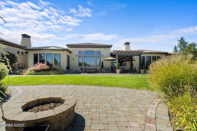 1555 Boulder Field Way, Reno, NV 89511 - back of property with a pergola, a patio area, a chimney, and a yard