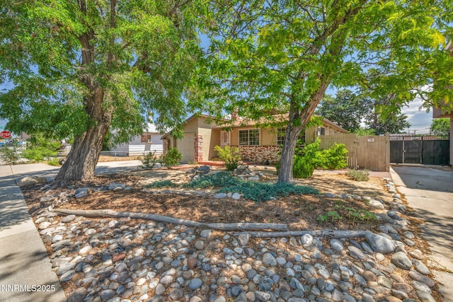 1320 Yori Ave, Reno, NV 89502 - view of front of house featuring an attached garage, stucco siding, and a gate