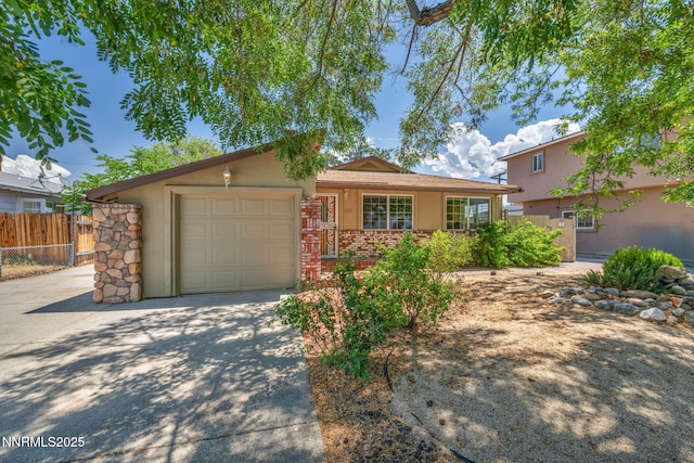 1320 Yori Ave, Reno, NV 89502 - ranch-style house with driveway, stucco siding, and a garage
