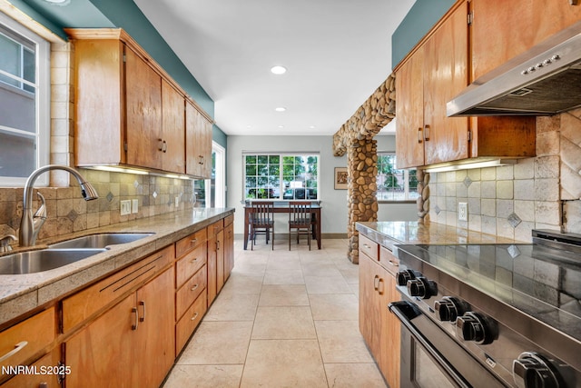 1320 Yori Ave, Reno, NV 89502 - kitchen featuring stove, ventilation hood, light countertops, backsplash, and recessed lighting