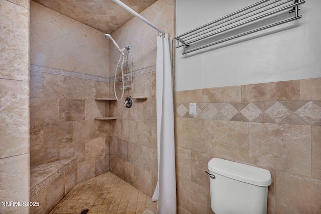 1320 Yori Ave, Reno, NV 89502 - bathroom featuring tiled shower and toilet