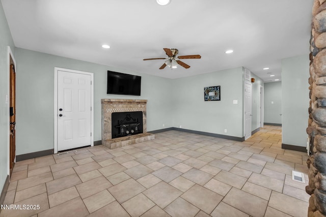 1320 Yori Ave, Reno, NV 89502 - unfurnished living room with a tile fireplace, ceiling fan, and recessed lighting