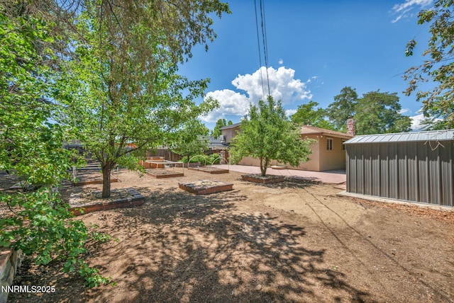 1320 Yori Ave, Reno, NV 89502 - view of yard with a vegetable garden and a patio