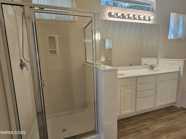 2735 Avenida De Landa, Reno, NV 89523 - full bathroom with double vanity, a stall shower, and wood finished floors