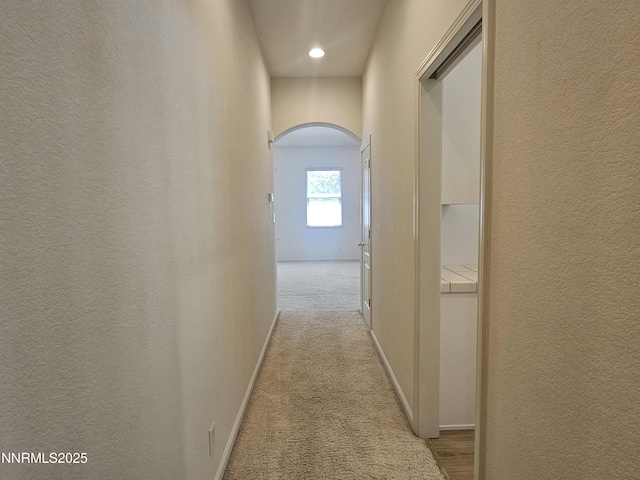 2735 Avenida De Landa, Reno, NV 89523 - hall with arched walkways, a textured wall, and light carpet