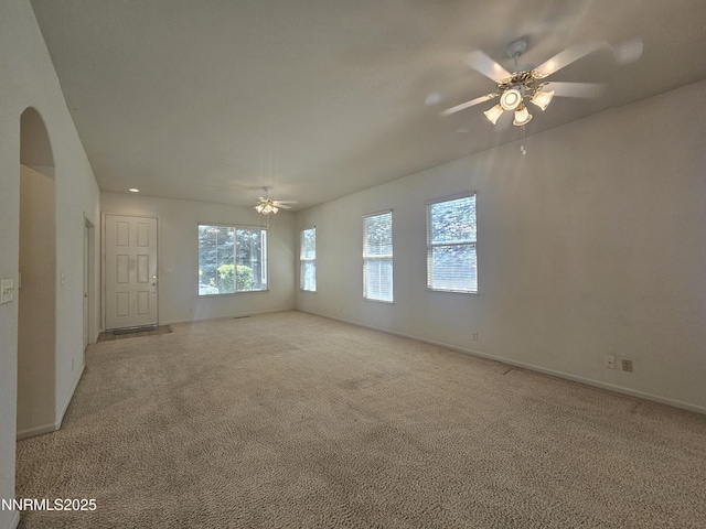 2735 Avenida De Landa, Reno, NV 89523 - unfurnished room featuring ceiling fan, light colored carpet, and arched walkways