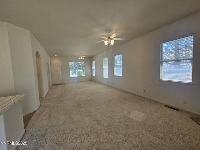 2735 Avenida De Landa, Reno, NV 89523 - empty room with ceiling fan, light carpet, and arched walkways
