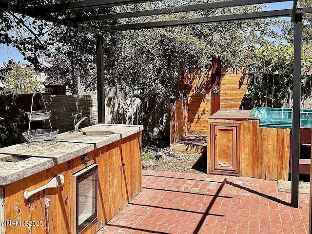 6673 Enchanted Valley Dr, Reno, NV 89523 - view of patio featuring wine cooler and a hot tub