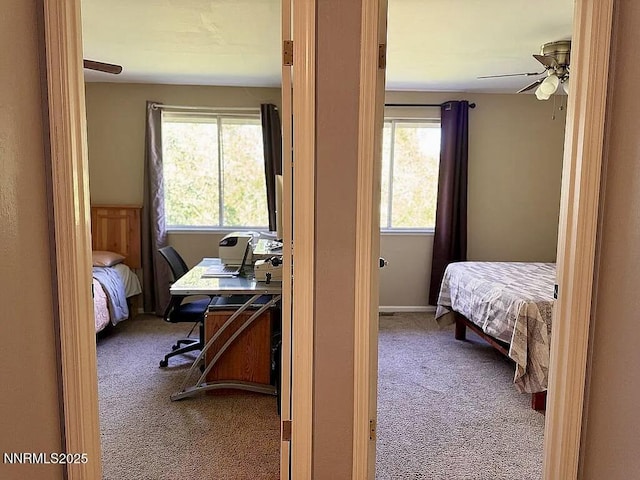 6673 Enchanted Valley Dr, Reno, NV 89523 - carpeted bedroom with an office area and a ceiling fan