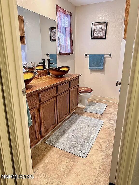6673 Enchanted Valley Dr, Reno, NV 89523 - half bath featuring vanity and toilet