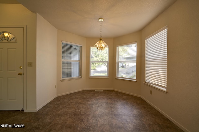 3082 Doubletree Ln, Carson City, NV 89701 - unfurnished dining area featuring a chandelier and baseboards