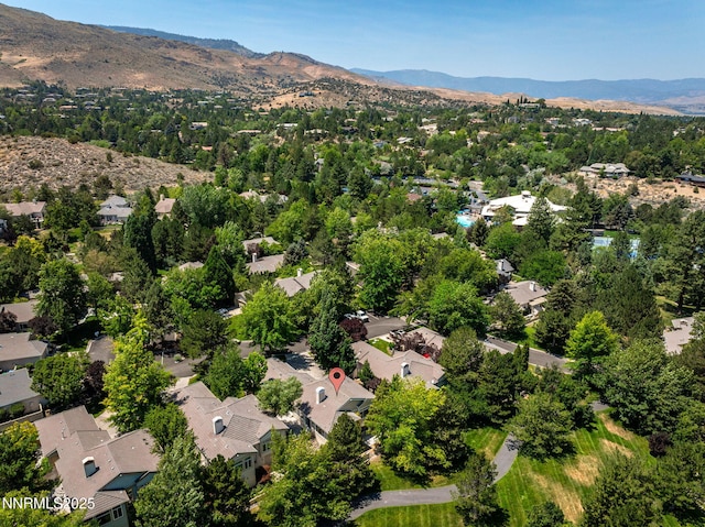4033 Clover Creek Ct, Reno, NV 89519 - aerial overview of property's location with a mountainous background and nearby suburban area