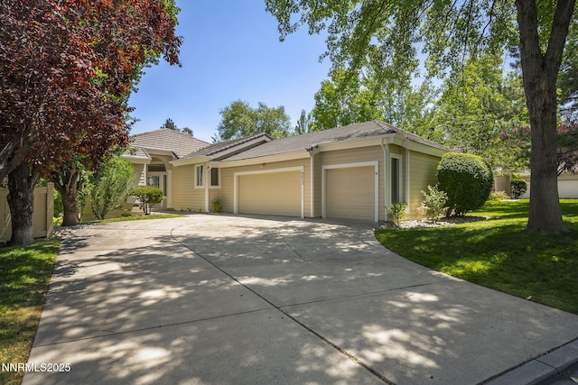4033 Clover Creek Ct, Reno, NV 89519 - ranch-style home with a garage, driveway, and a front yard