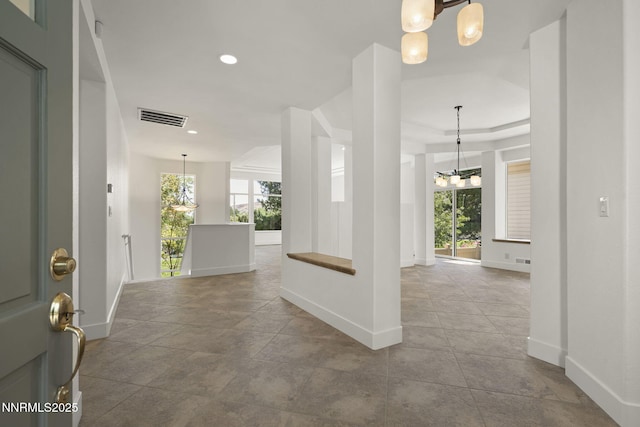 4033 Clover Creek Ct, Reno, NV 89519 - entrance foyer with a chandelier, recessed lighting, and a raised ceiling