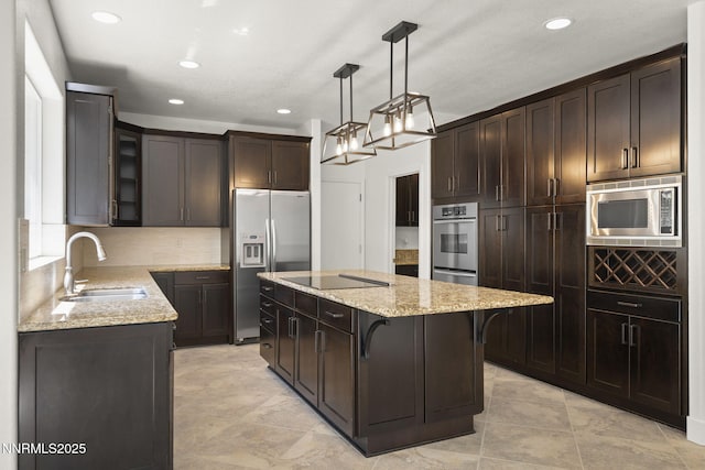 4033 Clover Creek Ct, Reno, NV 89519 - kitchen with appliances with stainless steel finishes, light stone countertops, a center island, dark brown cabinetry, and recessed lighting