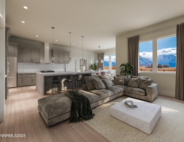 2769 Squires St, Minden, NV 89423 - living area featuring light wood-style floors, a mountain view, and recessed lighting
