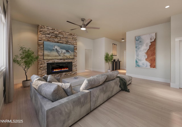 2769 Squires St, Minden, NV 89423 - living area featuring a fireplace, a ceiling fan, and light wood finished floors