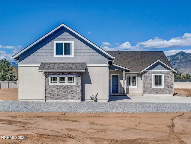 2800 Pamela Pl, Minden, NV 89423 - view of front of property with stone siding, a standing seam roof, a metal roof, and stucco siding