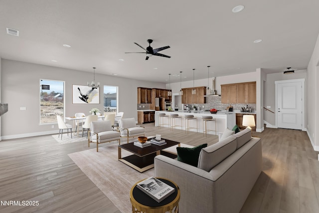 2800 Pamela Pl, Minden, NV 89423 - living area with light wood-style floors, a ceiling fan, recessed lighting, and a chandelier