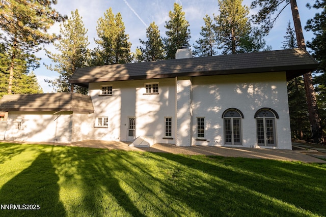 976 Caddie Ct, Incline Village, NV 89451 - back of property featuring a patio area, a chimney, a lawn, and brick siding