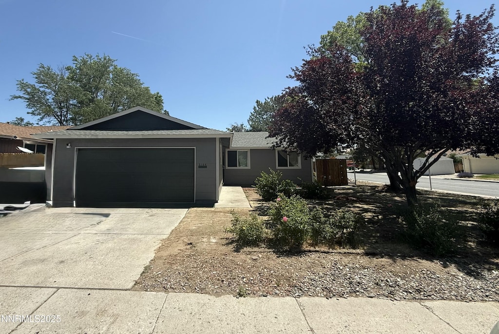3104 Sandy St, Sparks, NV 89431 - single story home featuring concrete driveway, an attached garage, and a shingled roof