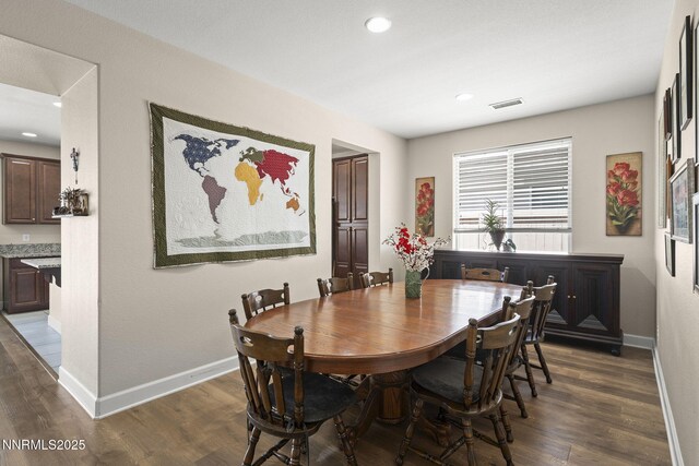10125 Mesa Cortona Dr, Reno, NV 89521 - dining area with dark wood finished floors and recessed lighting
