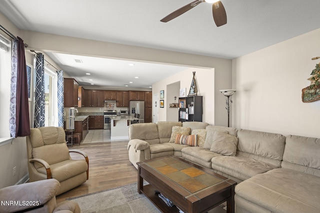 10125 Mesa Cortona Dr, Reno, NV 89521 - living area featuring ceiling fan, light wood finished floors, and recessed lighting