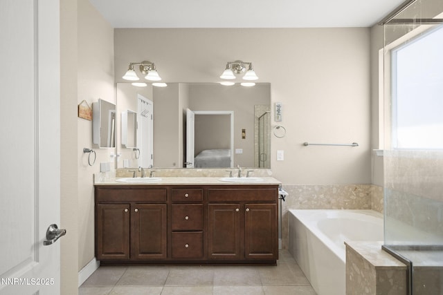 10125 Mesa Cortona Dr, Reno, NV 89521 - full bathroom with tile patterned floors, a bath, double vanity, and a shower