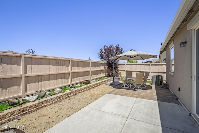 10125 Mesa Cortona Dr, Reno, NV 89521 - fenced backyard with outdoor dining area and a patio area