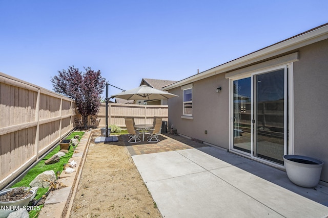 10125 Mesa Cortona Dr, Reno, NV 89521 - fenced backyard featuring a patio area