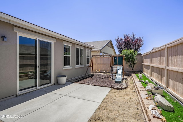 10125 Mesa Cortona Dr, Reno, NV 89521 - fenced backyard with a patio and a playground