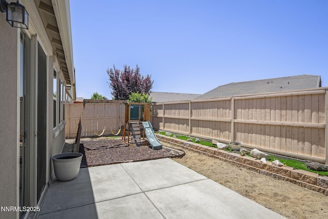 10125 Mesa Cortona Dr, Reno, NV 89521 - fenced backyard with a patio area and a playground