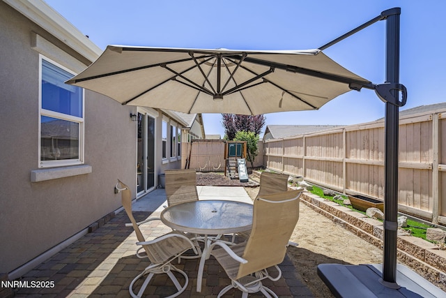 10125 Mesa Cortona Dr, Reno, NV 89521 - view of patio / terrace featuring outdoor dining space and a playground