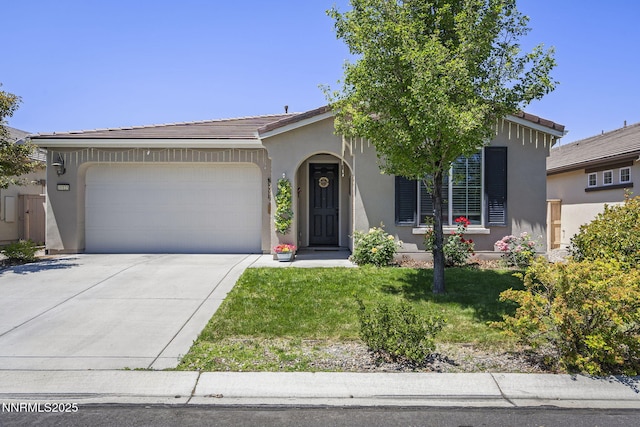 10125 Mesa Cortona Dr, Reno, NV 89521 - view of front of house featuring stucco siding, an attached garage, driveway, a front yard, and a tile roof