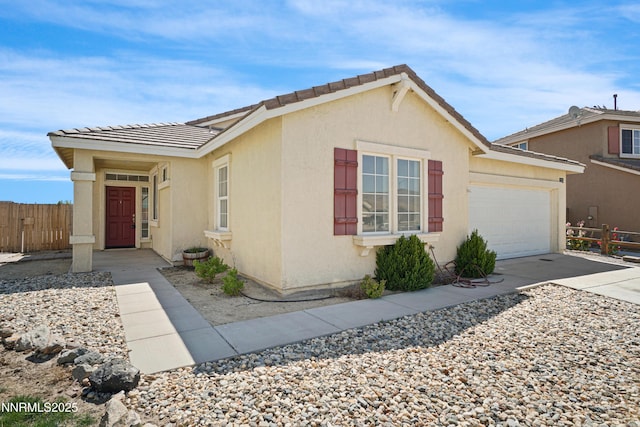 1723 Blue Oak Ct, Fernley, NV 89408 - view of front facade featuring an attached garage, driveway, stucco siding, and a tile roof