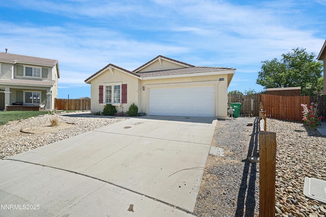 1723 Blue Oak Ct, Fernley, NV 89408 - single story home featuring driveway, a garage, and stucco siding