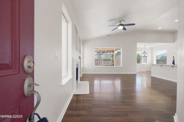 1723 Blue Oak Ct, Fernley, NV 89408 - entrance foyer featuring wood finished floors, a ceiling fan, a fireplace, and vaulted ceiling