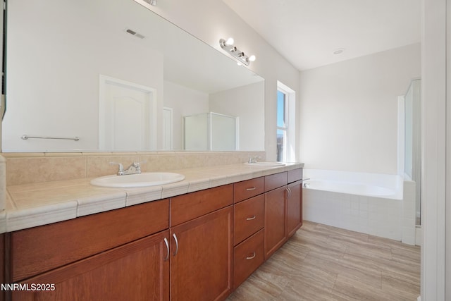 1723 Blue Oak Ct, Fernley, NV 89408 - full bathroom featuring double vanity, a bath, and an enclosed shower