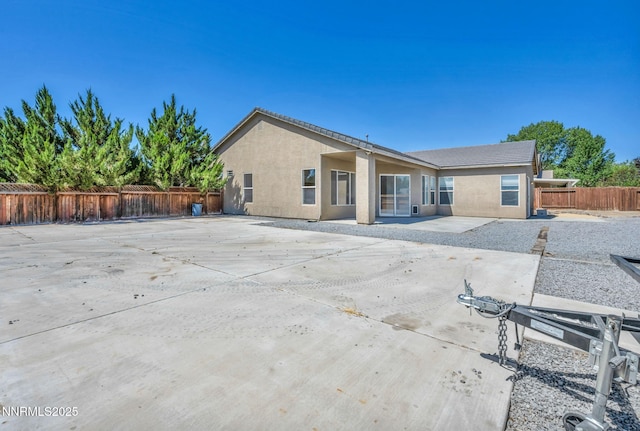 1048 Brierwood Ln, Fernley, NV 89408 - rear view of property with a patio, stucco siding, and a fenced backyard