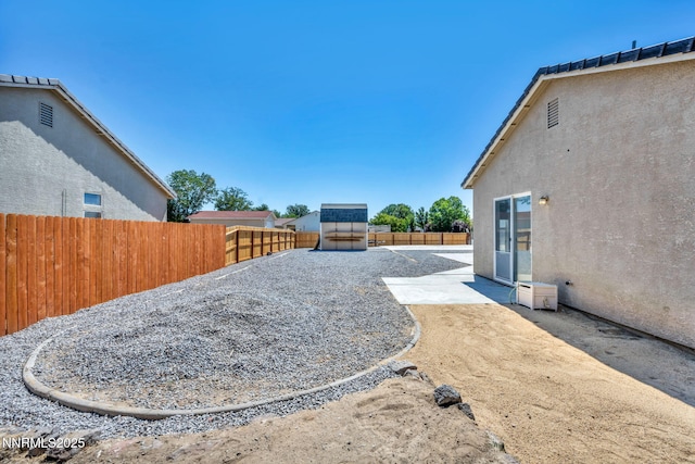 1048 Brierwood Ln, Fernley, NV 89408 - fenced backyard with a patio area