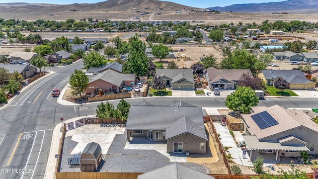 1048 Brierwood Ln, Fernley, NV 89408 - aerial perspective of suburban area with a mountainous background