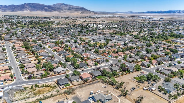 1048 Brierwood Ln, Fernley, NV 89408 - aerial view of property's location featuring a mountain backdrop and nearby suburban area