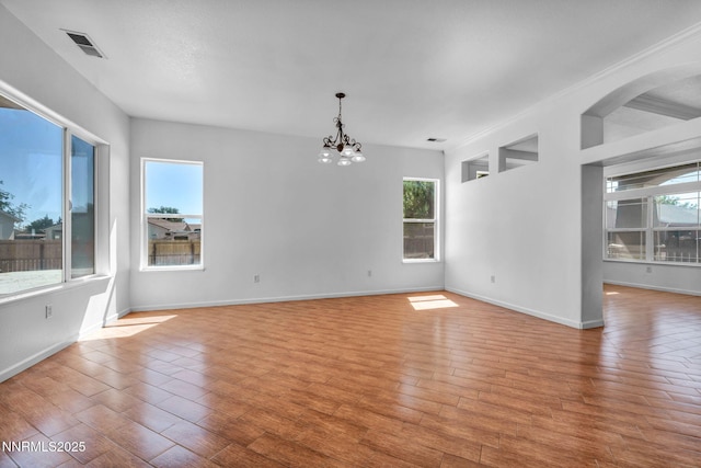 1048 Brierwood Ln, Fernley, NV 89408 - spare room with a chandelier and light wood-type flooring