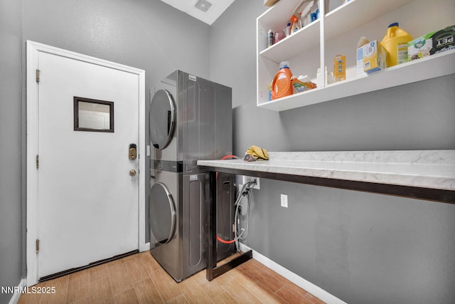 1048 Brierwood Ln, Fernley, NV 89408 - laundry area with stacked washer and clothes dryer and light wood-style flooring