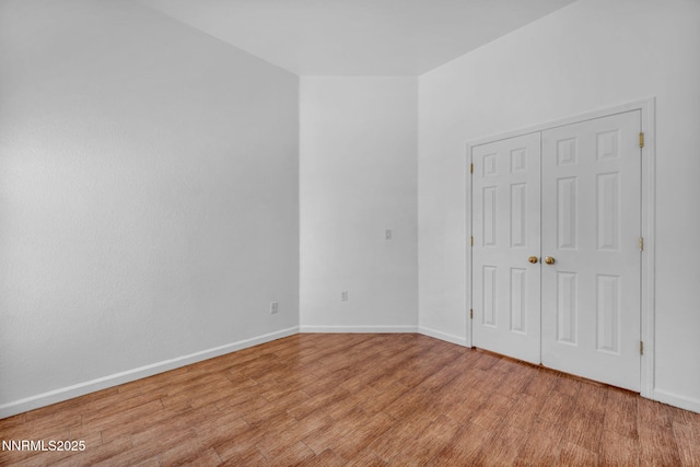 1048 Brierwood Ln, Fernley, NV 89408 - unfurnished bedroom featuring light wood-style floors and a closet