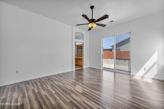1048 Brierwood Ln, Fernley, NV 89408 - spare room featuring arched walkways, wood finished floors, and a ceiling fan