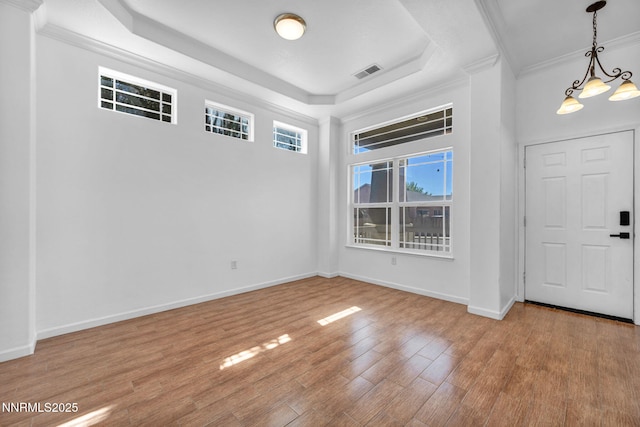 1048 Brierwood Ln, Fernley, NV 89408 - foyer entrance featuring wood finished floors, ornamental molding, and a tray ceiling