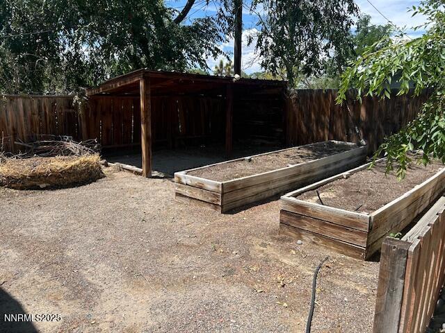 3220 Rice Rd, Fallon, NV 89406 - fenced backyard with a garden