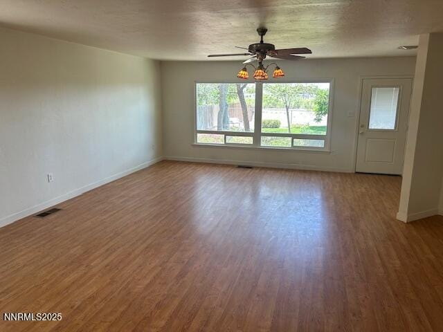 3220 Rice Rd, Fallon, NV 89406 - empty room with wood finished floors and a ceiling fan